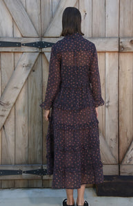 Curate in the long dress